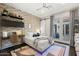 Stylish bedroom with a brick accent wall, modern decor, and a sliding glass door at 35556 N 87Th Pl, Scottsdale, AZ 85266