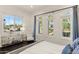 Bright bedroom featuring large windows offering scenic desert views at 35556 N 87Th Pl, Scottsdale, AZ 85266