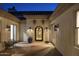 Private courtyard with decorative lighting, wrought iron chairs and lush potted plants at 35556 N 87Th Pl, Scottsdale, AZ 85266