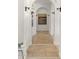 Inviting hallway with arched doorways, decorative lighting, and elegant tile flooring at 35556 N 87Th Pl, Scottsdale, AZ 85266
