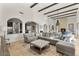 This living room has a sectional sofa, fireplace, and an open floor plan connecting to the kitchen at 35556 N 87Th Pl, Scottsdale, AZ 85266