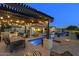 Backyard oasis with covered dining, outdoor kitchen, pool, and spa at 35556 N 87Th Pl, Scottsdale, AZ 85266