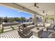 Covered patio with comfortable seating overlooking the pool and beautiful desert landscape at 35556 N 87Th Pl, Scottsdale, AZ 85266