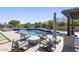 Enjoy outdoor living with this beautiful pool, seating area, and lush landscaping that creates a backyard oasis at 35556 N 87Th Pl, Scottsdale, AZ 85266