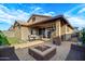 Spacious backyard with outdoor seating, fire pit, green space, and string lights for entertaining at 3890 E Perkinsville St, Gilbert, AZ 85295