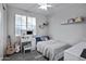 Cozy bedroom with a vanity, window, and neutral decor at 3890 E Perkinsville St, Gilbert, AZ 85295