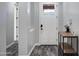 Bright foyer featuring modern tiled floors and a white front door at 3890 E Perkinsville St, Gilbert, AZ 85295
