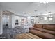 This open floorplan showcases a kitchen with white cabinetry and center island at 3890 E Perkinsville St, Gilbert, AZ 85295