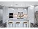Bright kitchen boasts white cabinetry, granite counters, and stainless appliances at 3890 E Perkinsville St, Gilbert, AZ 85295