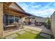 Outdoor patio featuring a dining table with chairs, fire pit and decorative plants at 3890 E Perkinsville St, Gilbert, AZ 85295