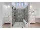 Modern bathroom with glass shower, built in bench and dual sinks at 4246 E Mulberry Dr, Phoenix, AZ 85018
