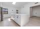 Bright, modern kitchen boasts a large island, skylights, and ample storage space at 4246 E Mulberry Dr, Phoenix, AZ 85018