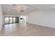Spacious living room with light wood floors, recessed lighting, and sliding glass doors to the backyard at 4246 E Mulberry Dr, Phoenix, AZ 85018