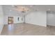 Bright living room features wood floors, recessed lights, statement light fixture and views to the exterior at 4246 E Mulberry Dr, Phoenix, AZ 85018
