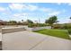 Lush backyard boasts green grass, well-manicured landscaping, and scenic outdoor space for relaxation at 4451 E Joshua Tree Ln, Paradise Valley, AZ 85253