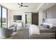 Bright bedroom with large windows, a decorative sliding door, and cozy seating at 4451 E Joshua Tree Ln, Paradise Valley, AZ 85253