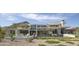 Contemporary home with a water feature, manicured landscaping, and multiple outdoor seating areas at 4451 E Joshua Tree Ln, Paradise Valley, AZ 85253