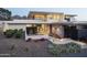 Modern home with manicured desert landscaping and contemporary architectural details at the front entrance at 4451 E Joshua Tree Ln, Paradise Valley, AZ 85253