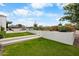 Well-maintained front yard with lush green grass, landscaped features, and inviting steps to the home at 4451 E Joshua Tree Ln, Paradise Valley, AZ 85253