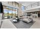 Bright living room with fireplace, offering mountain views, floor-to-ceiling windows, and stylish decor at 4451 E Joshua Tree Ln, Paradise Valley, AZ 85253