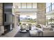 Open-concept living area boasting a fireplace, modern decor, and seamless outdoor access at 4451 E Joshua Tree Ln, Paradise Valley, AZ 85253