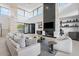 Spacious living room with a fireplace, comfortable seating, and contemporary design accents at 4451 E Joshua Tree Ln, Paradise Valley, AZ 85253