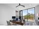 Office with mountain views, workspace with desk and computer, and balcony access at 4451 E Joshua Tree Ln, Paradise Valley, AZ 85253