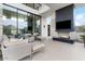 Relaxing outdoor living area with a fireplace, comfortable seating, and scenic views at 4451 E Joshua Tree Ln, Paradise Valley, AZ 85253