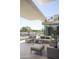 Outdoor patio featuring modern furniture, a water feature, and balcony views at 4451 E Joshua Tree Ln, Paradise Valley, AZ 85253