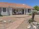 Well-manicured backyard featuring mature landscaping, a covered patio, and privacy at 4517 E Ute St, Phoenix, AZ 85044