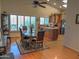 Bright dining room featuring a wooden table with seating for six, bathed in natural light from large windows at 4517 E Ute St, Phoenix, AZ 85044