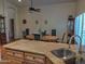 Dining room with wood table, comfortable chairs, and granite kitchen island and sink at 4517 E Ute St, Phoenix, AZ 85044