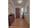 Welcoming entryway with hardwood floors, an elegant wood door and lots of natural light at 4517 E Ute St, Phoenix, AZ 85044