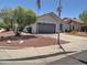 Street view of a well-maintained home with desert landscaping and a two car garage at 4517 E Ute St, Phoenix, AZ 85044