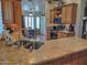 Kitchen featuring granite countertops, stainless steel sink, and light wood cabinets at 4517 E Ute St, Phoenix, AZ 85044