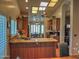 Bright, open kitchen featuring granite countertops, wood cabinets, and stainless steel appliances at 4517 E Ute St, Phoenix, AZ 85044