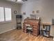 Spacious office with wood floors, a roll top desk, and a bright window at 4517 E Ute St, Phoenix, AZ 85044