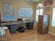 Bright office space with multiple windows and a large desk at 4517 E Ute St, Phoenix, AZ 85044