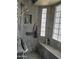 Modern shower with built-in bench, tiled walls and glass block window at 4517 E Ute St, Phoenix, AZ 85044