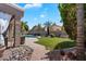 Well-manicured backyard with a private pool and lush landscaping at 4569 E Lariat Ln, Phoenix, AZ 85050