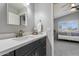 Stylish bathroom featuring modern vanity, a mirror, and great natural light at 4569 E Lariat Ln, Phoenix, AZ 85050