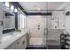 Modern bathroom featuring a glass-enclosed shower with sleek fixtures and marble tile at 4569 E Lariat Ln, Phoenix, AZ 85050