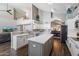 Bright, open kitchen with a large island, sleek countertops, and modern appliances flows seamlessly into the living areas at 4569 E Lariat Ln, Phoenix, AZ 85050