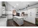 Bright kitchen with white cabinets, marble countertops, stainless appliances, and hardwood floors at 4569 E Lariat Ln, Phoenix, AZ 85050