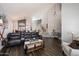 Open-concept living area with wood floors, tall ceilings, and staircase at 4569 E Lariat Ln, Phoenix, AZ 85050