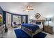 Inviting main bedroom with a ceiling fan, calming colors, and plenty of natural light at 4569 E Lariat Ln, Phoenix, AZ 85050