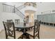 Elegant dining area with a decorative staircase, hardwood floors, and seamless open-concept design at 4607 S Venus --, Mesa, AZ 85212