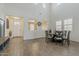 Inviting dining area filled with natural light, showcasing tile floors and an elegant table setting at 4607 S Venus --, Mesa, AZ 85212