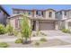 Inviting two-story home with manicured front yard, a two-car garage, and a neutral color palette at 4607 S Venus --, Mesa, AZ 85212
