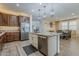 Spacious open kitchen featuring an island with granite countertops and stainless-steel appliances at 4607 S Venus --, Mesa, AZ 85212